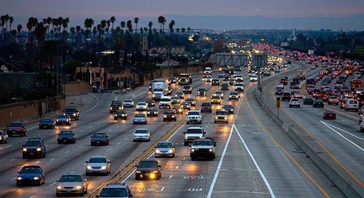 The 110 Freeway south of downtown on a busy evening. State legislators are moving to allow lone motorists use carpool lanes on congested stretches of the 110 and 10 freeways for a fee.