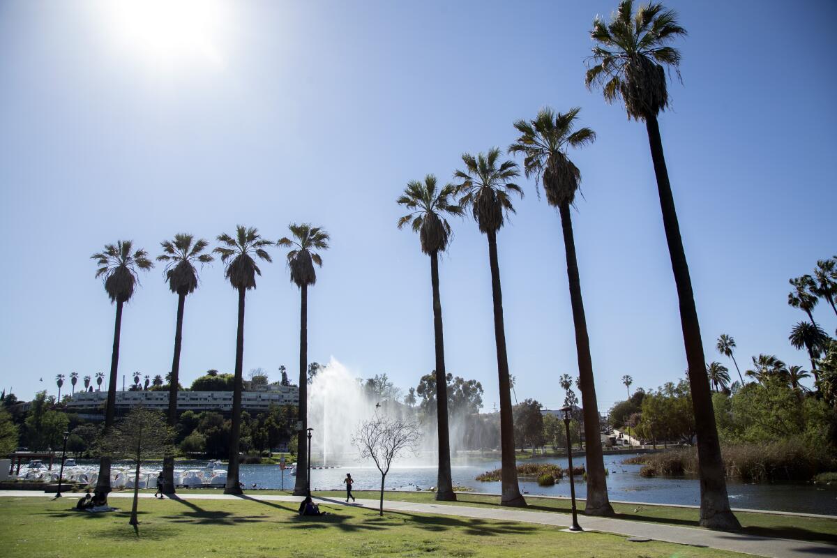 Visitors walk through Echo Park. 