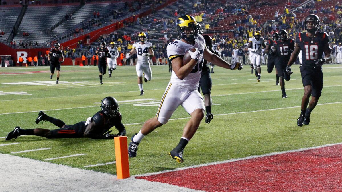 Michigan running back Ty Isaac scores a touchdown against Rutgers on Saturday.