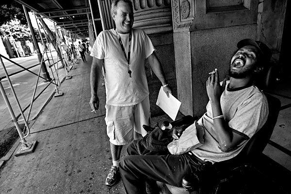 Paul Sigler, standing by his friend and fellow Project 50 participant Mohammed Duala, was rare in the L.A. County program for the hard-core homeless. He knew enough of the outside world to go back -- maybe.