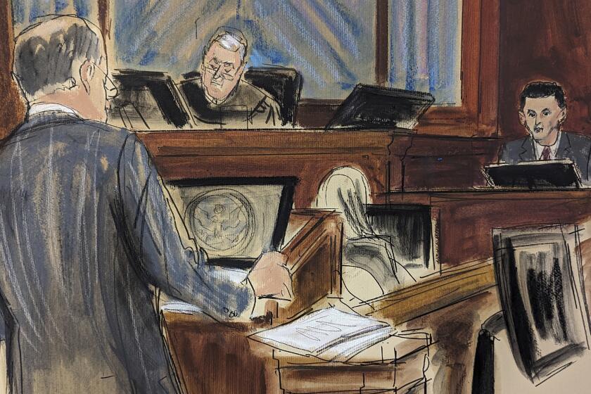 In this courtroom sketch, FTX founder Sam Bankman-Fried, right, is questioned by his attorney, Mark Cohen, left, as Judge Lewis Kaplan listens on the bench, center, during his trial in Manhattan federal court, Thursday, Oct. 26, 2023, in New York. (Elizabeth Williams via AP)