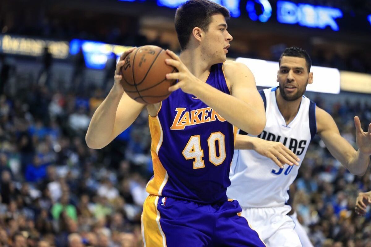 Lakers center Ivica Zubac (40) looks to pass against Dallas Mavericks center Salah Mejri during the first half on Jan. 22.