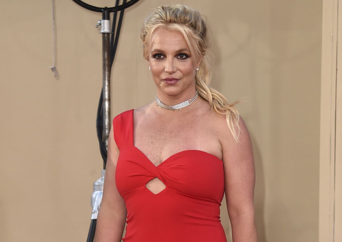 Britney Spears in a red dress at a film premiere