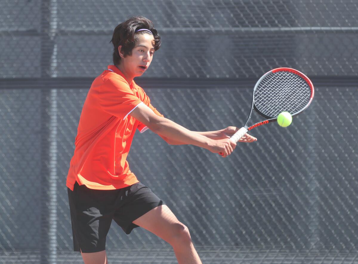 Caleb Goodman runs down a backhand in his Wave League boys' tennis singles match.