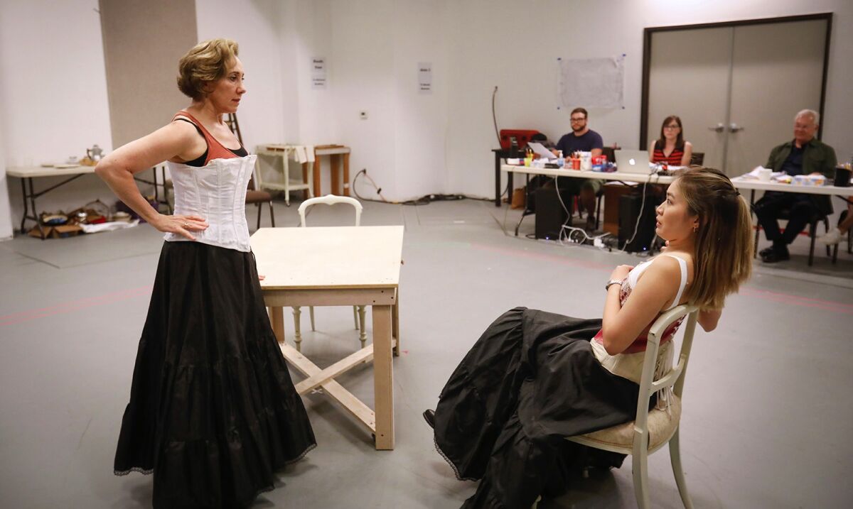 Joanna Glushak (left) and Regina De Vera rehearse a scene from “The Underpants.”