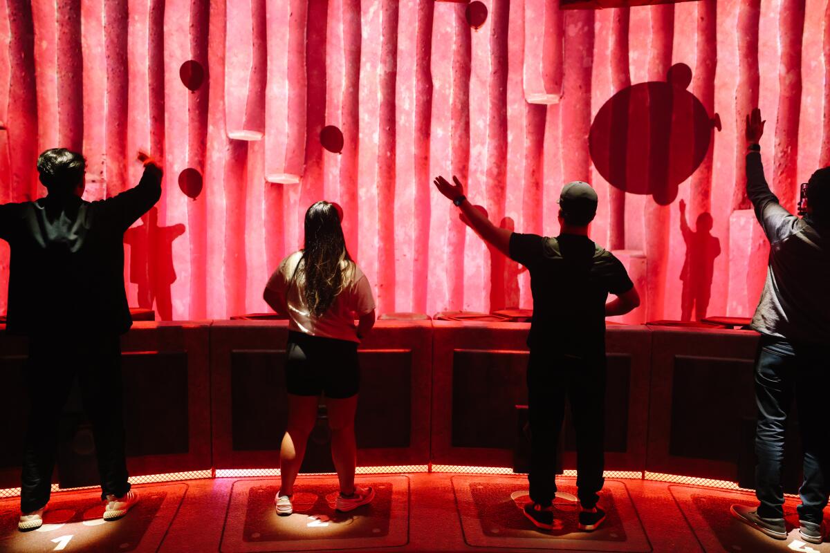 People experience one of the attractions at Super Nintendo World. (Dania Maxwell / Los Angeles Times)