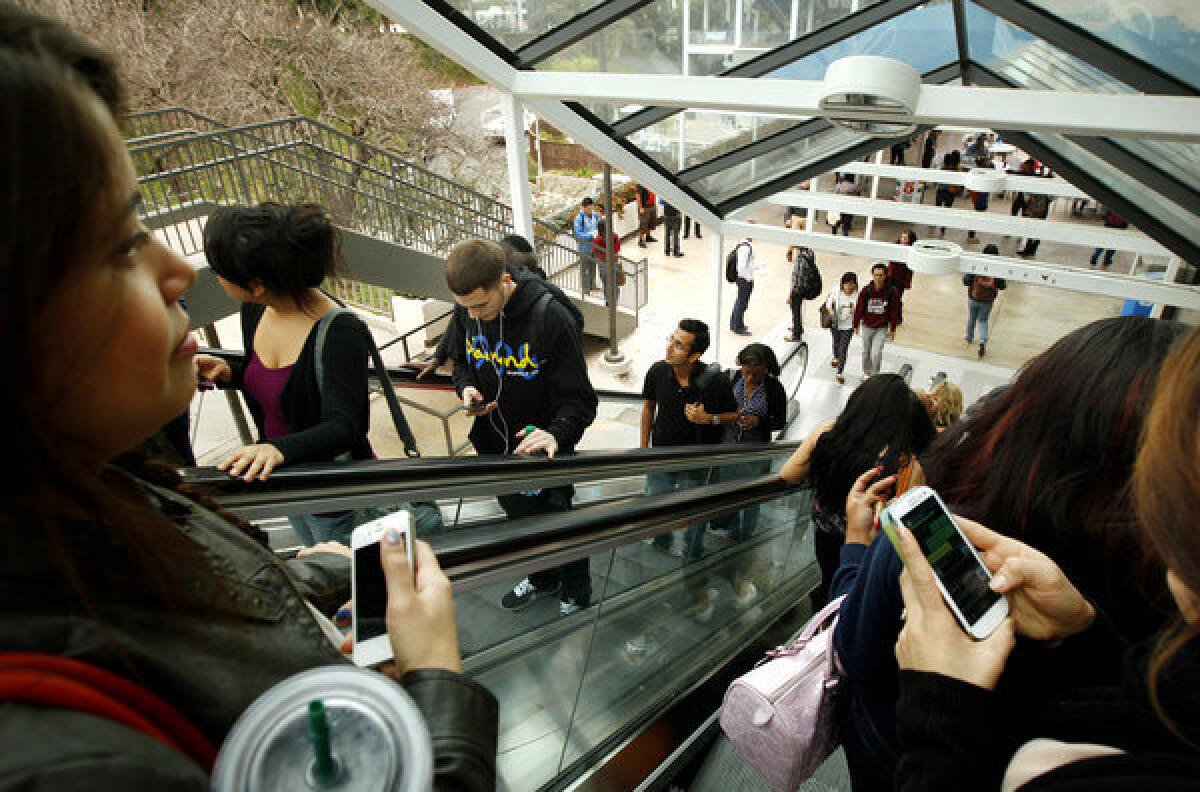 Cal State Long Beach students between classes on Jan. 23. A new Cal State budget proposal would include money to accommodate more students.