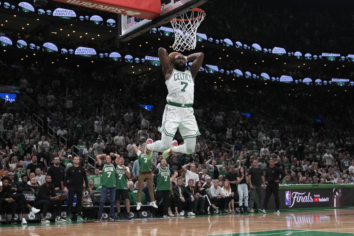 Boston Celtics guard Jaylen Brown dunks during a 107-89 victory over the Dallas Mavericks.