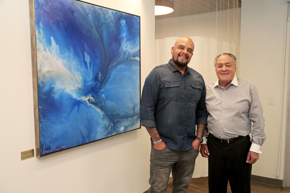 Cancer survivor Frank Di Bella and abstract artist Leonardo Cruz Melo.