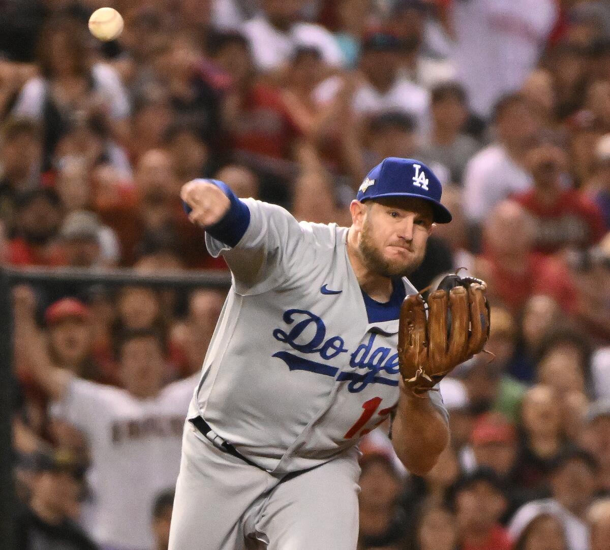 Dodgers third baseman Max Muncy throws to first in Game 3 against the Diamondbacks.