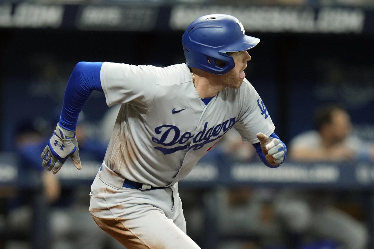 The Dodgers' Freddie Freeman watches his go-ahead, RBI double during the seventh inning.