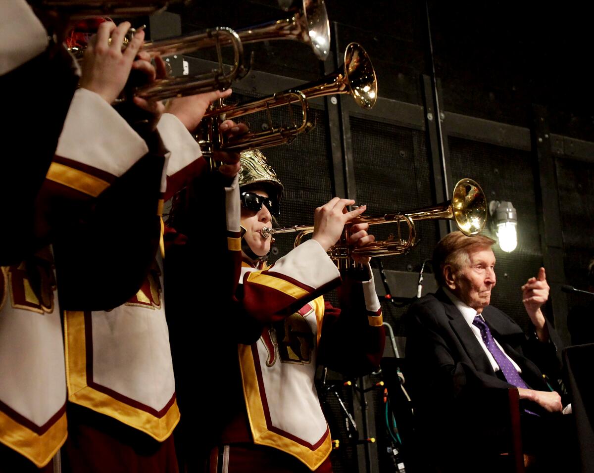 Sumner Redstone, right, with members of the USC marching band in 2013.