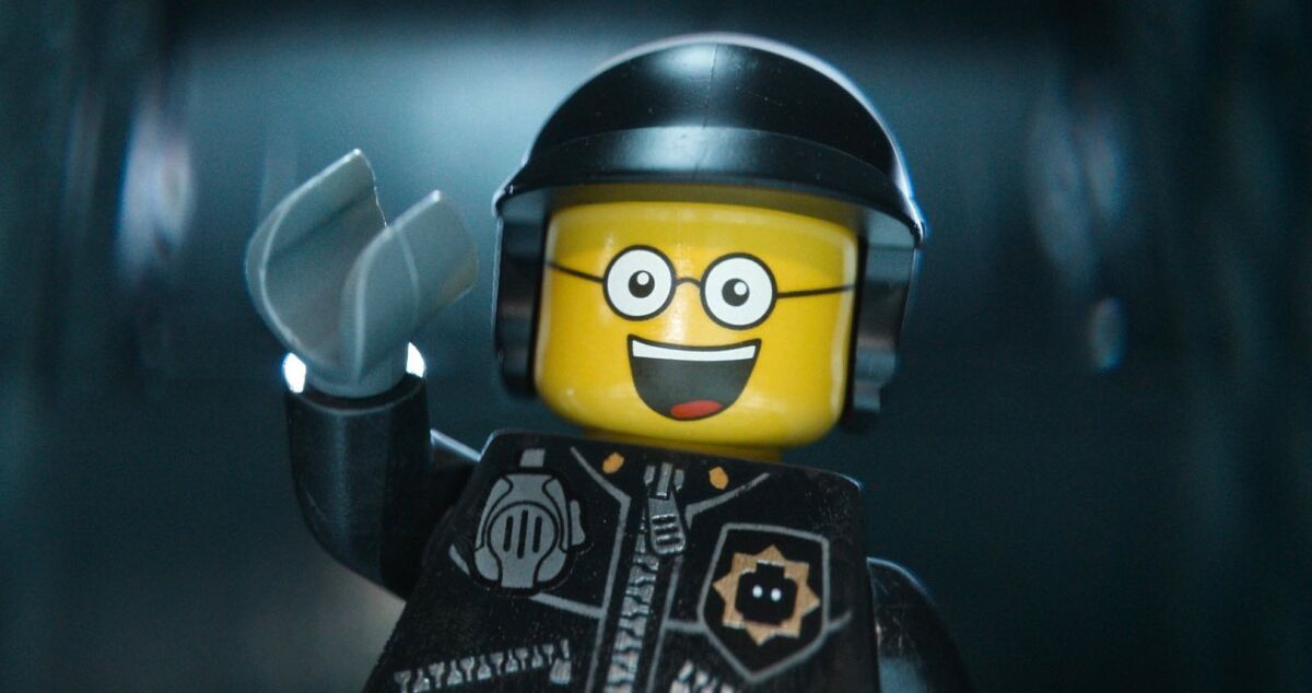 The character Good Cop/Bad Cop, voiced by Liam Neeson, appears in a scene from "The Lego Movie."