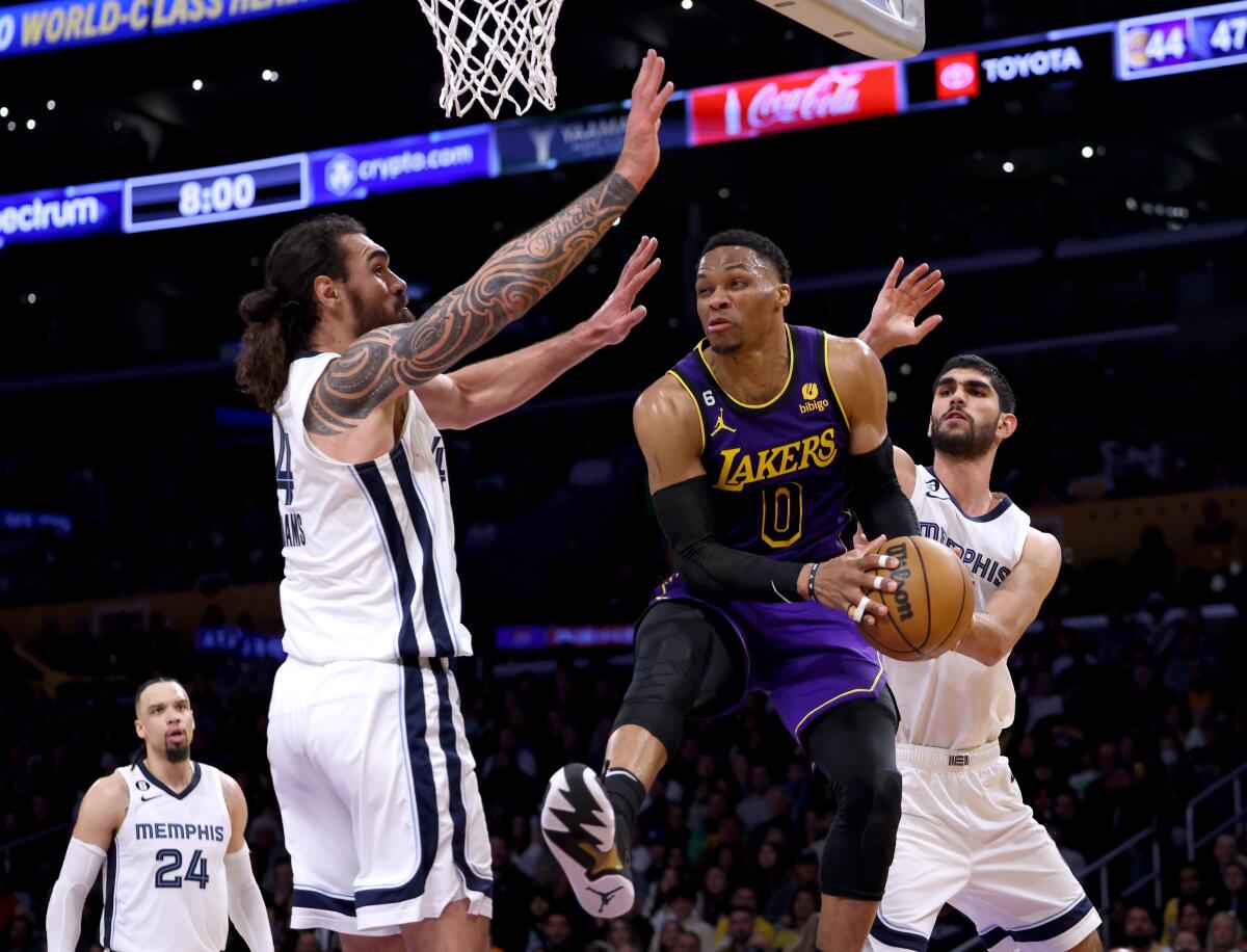 Lakers guard Russell Westbrook tries to pass in front of Memphis Grizzlies center Steven Adams.