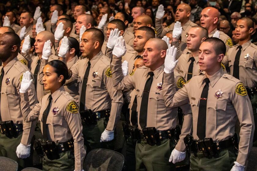 Los Angeles, CA - March 03: Los Angeles County Sheriff Academy Class 464 graduates take oath at graduation ceremony at East Los Angeles College on Friday, March 3, 2023 in Los Angeles, CA. (Irfan Khan / Los Angeles Times)