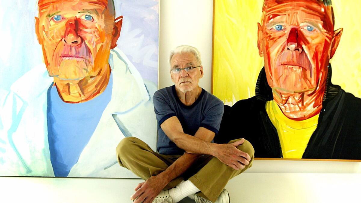 Don Bachardy in 2003 with two of his portraits of Isherwood, who died in 1986. (Francine Orr / Los Angeles Times)