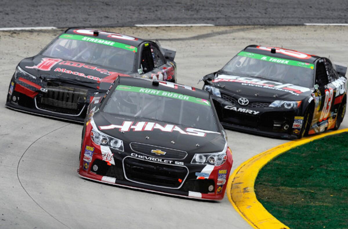 NASCAR driver Kurt Busch leads teh field in his No. 41 Chevrolet during the Sprint Cup Series STP 500 race at Martinsville Speedway on Sunday.