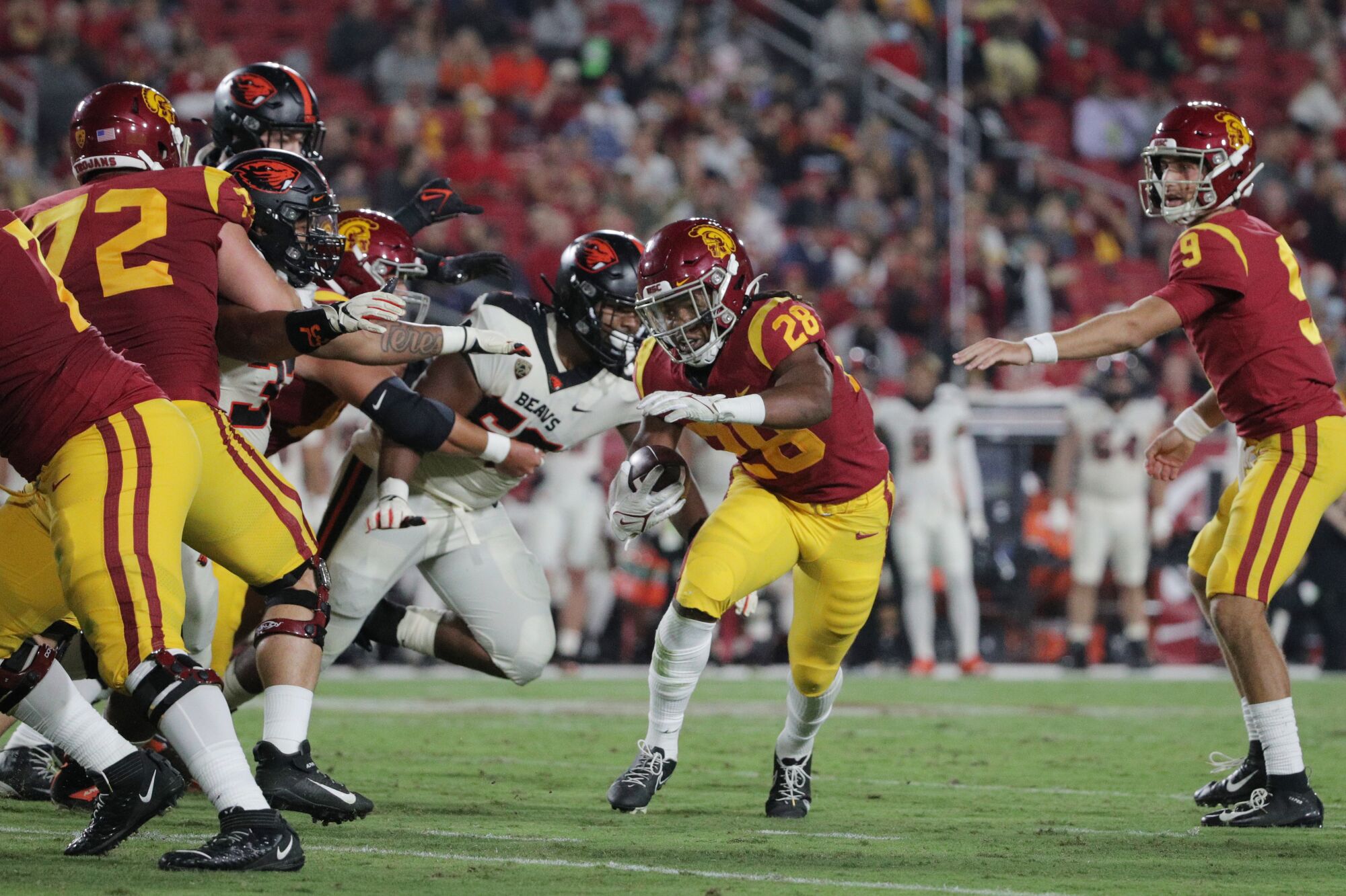 USC running back Keaontay Ingram eludes the Oregon State defense to score a first-half touchdown.