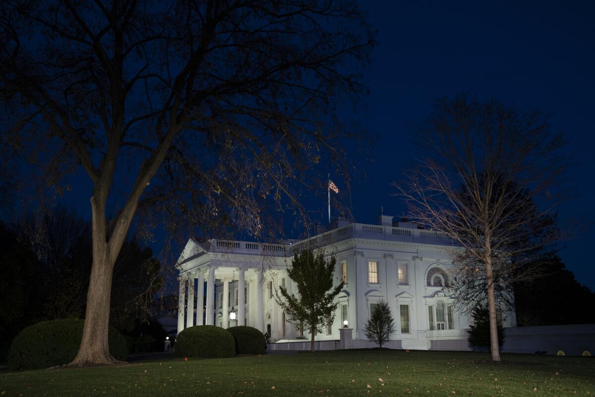 An exterior view of the White House at night