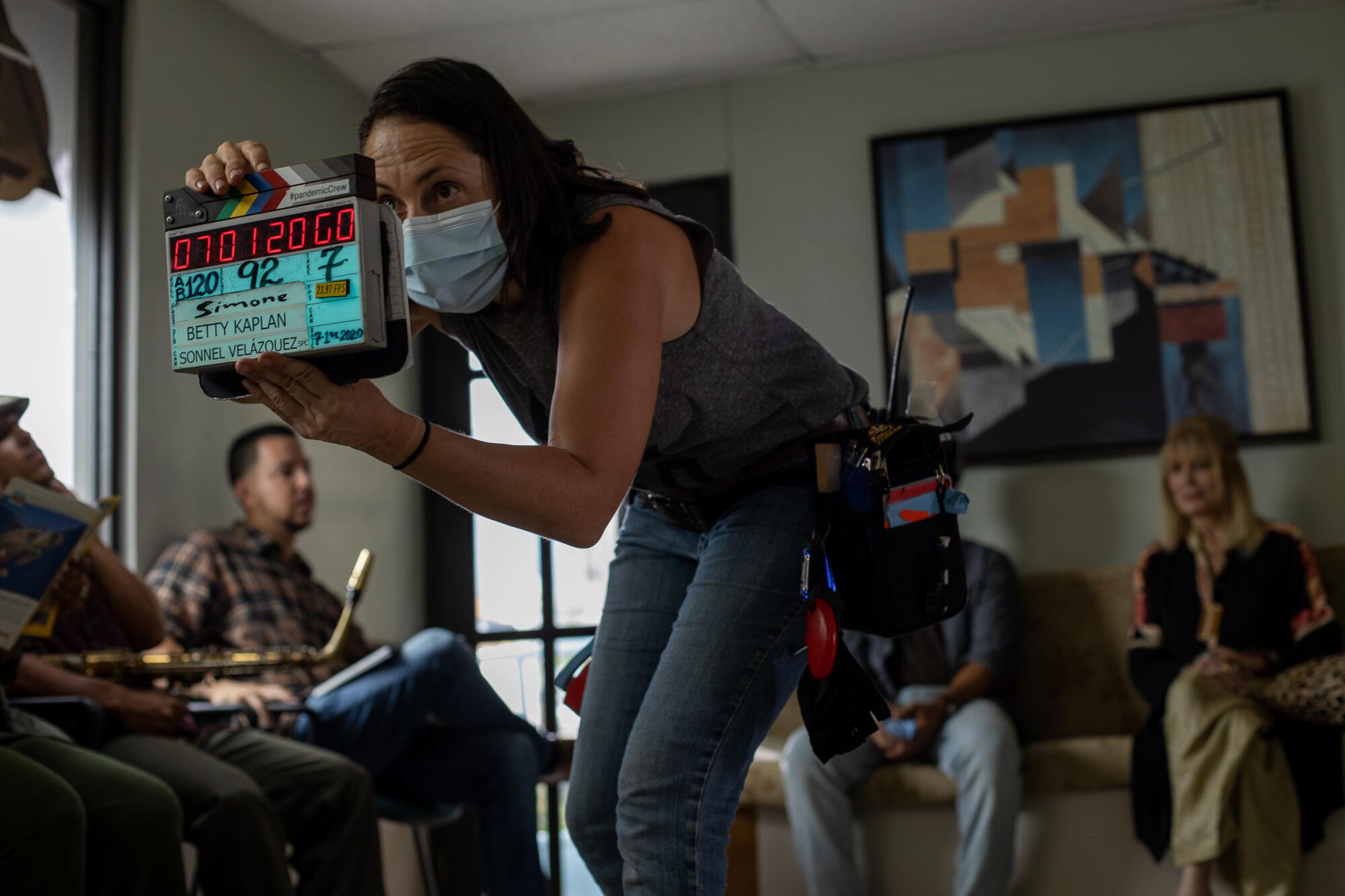 The clapboard for a scene during filming of "Simone."