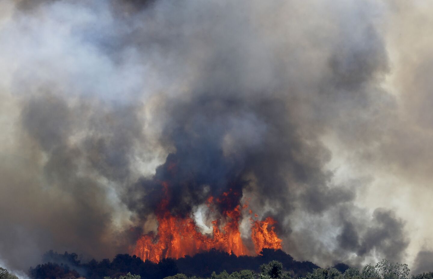 The Apple fire burns in the San Bernardino Mountains above Beaumont on Saturday.