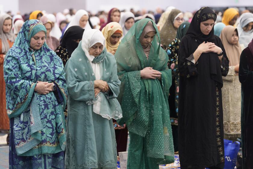 American Muslims women pray to mark the end of the holy month of Ramadan at Petree Hall in Los Angeles Wednesday, April 10, 2024. As the war in Gaza enters its seventh month, some Muslim and Arab American leaders have grown frustrated with outreach from President Joe Biden's White House. The fractured relationship could jeopardize the Democratic president's reelection campaign and help pave the way for Republican Donald Trump to return to the White House. (AP Photo/Damian Dovarganes)