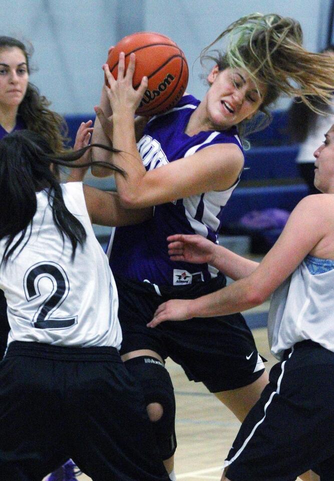 Hoover's Luna Panosian tries to keep control of the ball after leaping into the lane without a place to go with the ball Mayfield's in a Flintridge Prep summer league girls basketball game in La Canada Flintridge on Thursday, June 26, 2014. (Tim Berger/Staff Photographer)