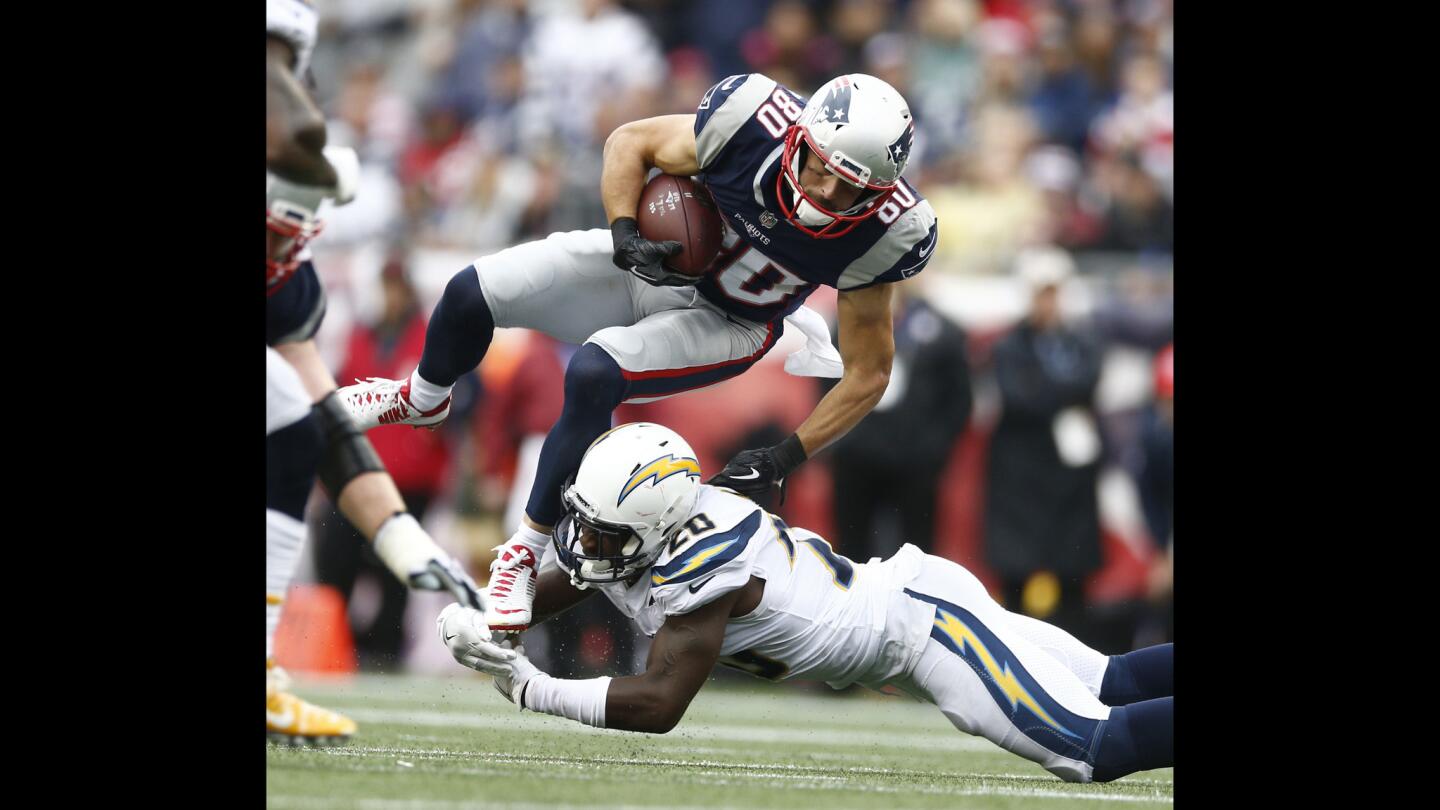New England Patriots wide receiver Danny Amendola is tripped up by Los Angeles Chargers defensive back Desmond King during the second half.