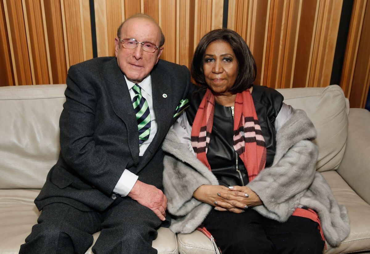 Clive Davis, with Aretha Franklin in December in New York, is preparing for his annual pre-Grammy Awards party on Saturday. He's also receiving the NAACP Vanguard Award on Friday night.