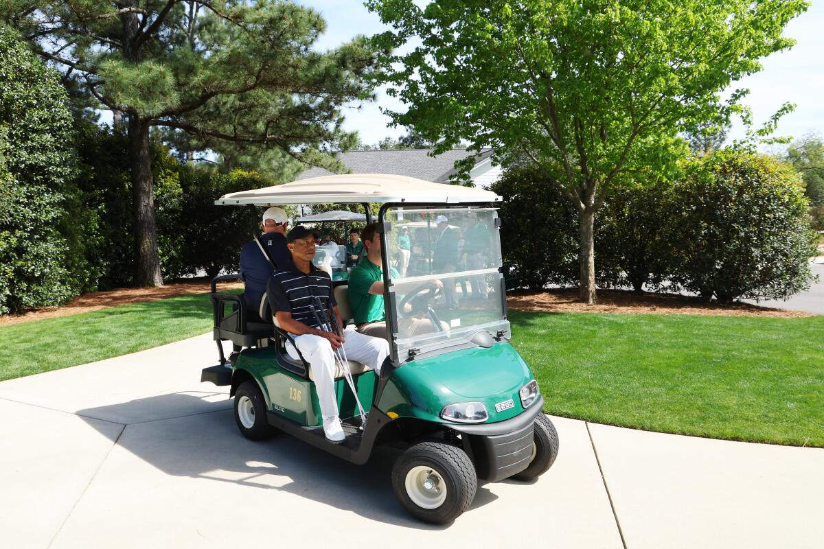 Tiger Woods rides in a golf cart during practice for the Masters.