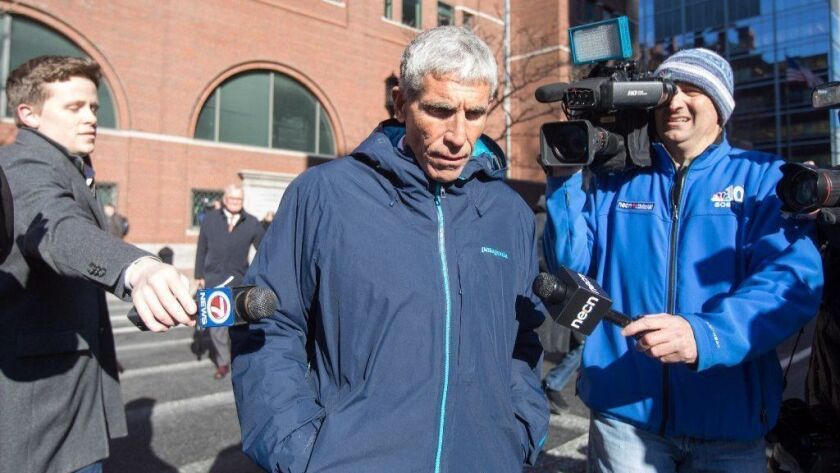 William "Rick" Singer, who was among several charged in an alleged college admissions scam, leaves federal court in Boston. Experts say the scam could prompt big changes in higher-education admissions.