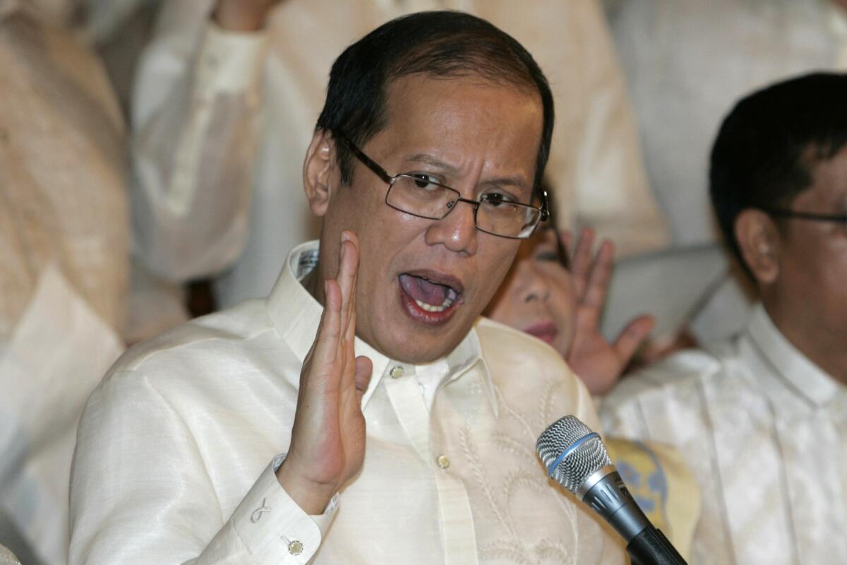 Benigno Aquino III speaks at a microphone
