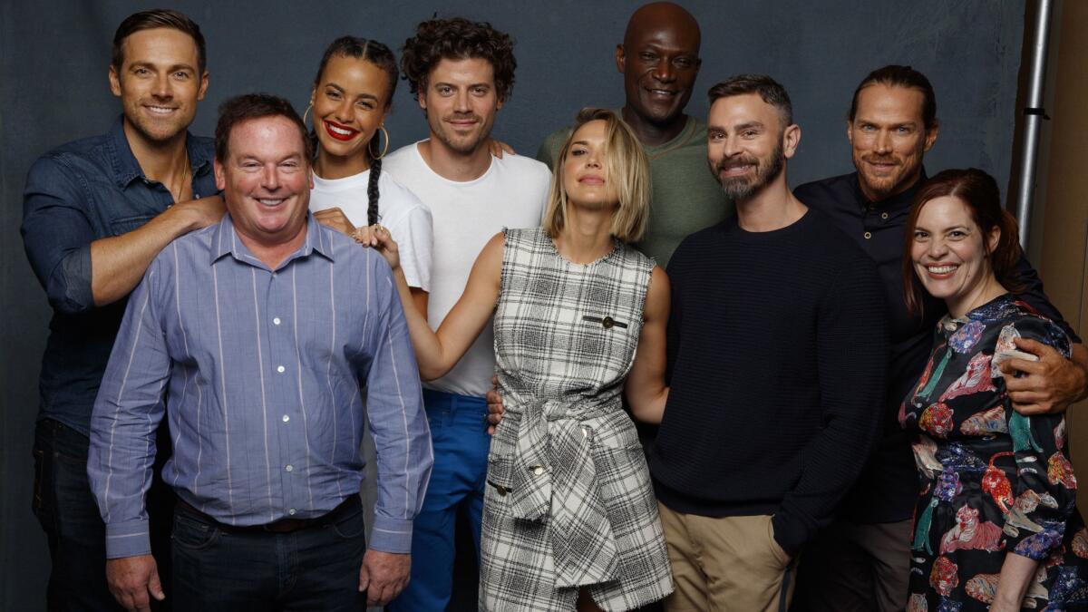 Dylan Bruce, from left, Parisa Fitz-Henley, Francois Arnaud, Arielle Kebbel, Peter Mensah, Jason Lewis, David Janollari, Nicole Snyder and Eric Charmelo from the TV drama "Midnight, Texas."