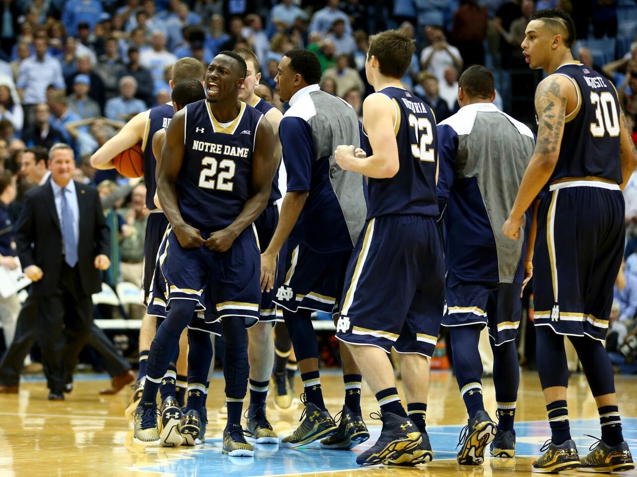 Notre Dame's Jerian Grant and his teammates celebrate after defeating North Carolina.