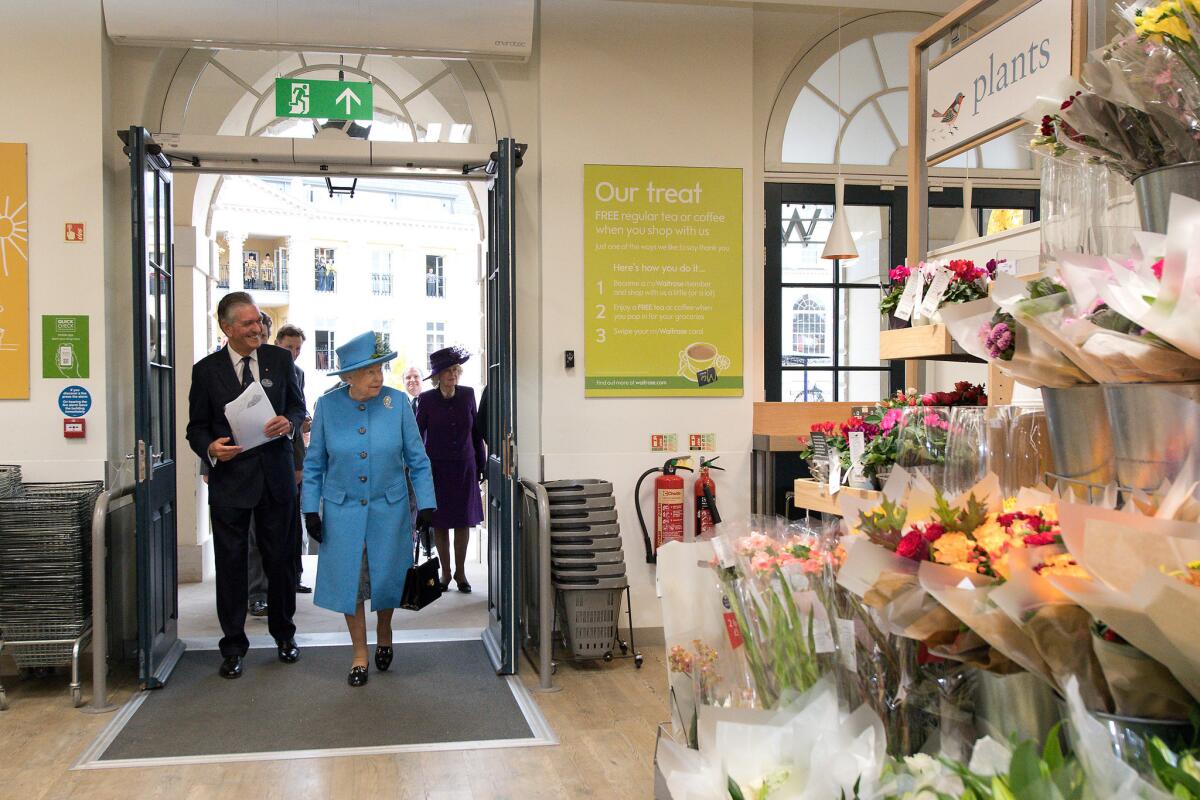 Queen Elizabeth II arrives to look around a Waitrose supermarket during a visit to the town of Poundbury.