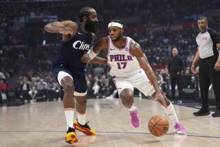 Philadelphia 76ers guard Buddy Hield (17) drives past Los Angeles Clippers guard James Harden.
