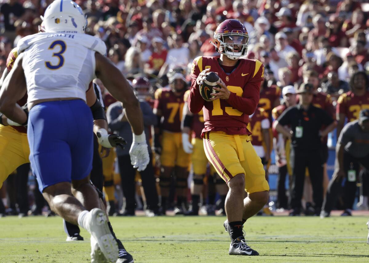 USC quarterback Caleb Williams looks for wide receiver Dorian Singer before passing for a 13-yard touchdown.
