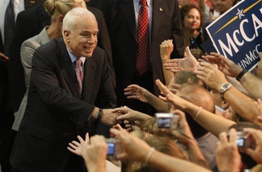 Republican presidential candidate Sen. John McCain, R-Ariz. greets supporters at the conclusion of a campaign rally in Tampa, Fla., Tuesday, Sept. 16, 2008. (AP Photo/Stephan Savoia)