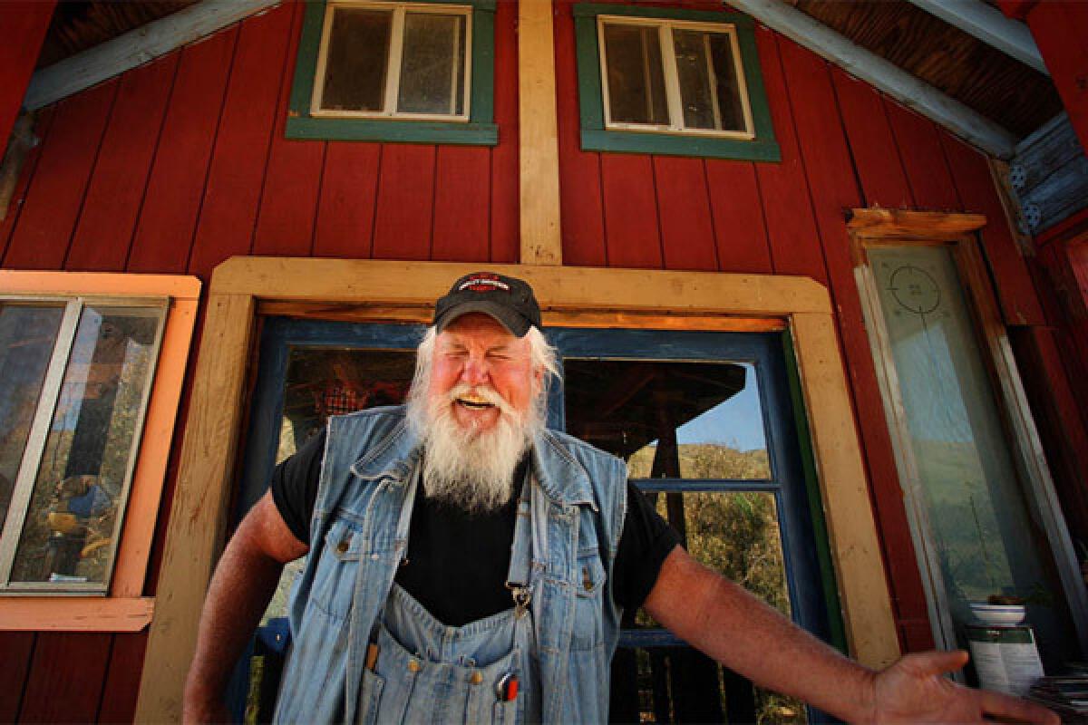Alan Kimble Fahey shows off the high desert home he has been working on for decades