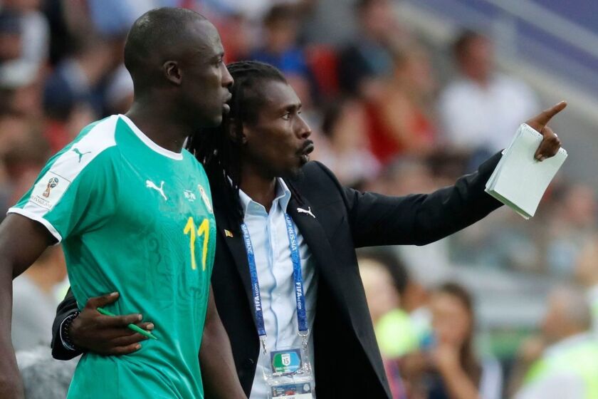 EDITORIAL USE ONLY Mandatory Credit: Photo by FELIPE TRUEBA/EPA-EFE/REX/Shutterstock (9721596jo) Senegal's coach Aliou Cisse and Cheikh N'Doye of Senegal Group H Poland vs Senegal, Moscow, Russian Federation - 19 Jun 2018 Senegal's coach Aliou Cisse (R) gives instructions to his player Cheikh N'Doye during the FIFA World Cup 2018 group H preliminary round soccer match between Poland and Senegal in Moscow, Russia, 19 June 2018. (RESTRICTIONS APPLY: Editorial Use Only, not used in association with any commercial entity - Images must not be used in any form of alert service or push service of any kind including via mobile alert services, downloads to mobile devices or MMS messaging - Images must appear as still images and must not emulate match action video footage - No alteration is made to, and no text or image is superimposed over, any published image which: (a) intentionally obscures or removes a sponsor identification image; or (b) adds or overlays the commercial identification of any third party which is not officially associated with the FIFA World Cup) ** Usable by LA, CT and MoD ONLY **