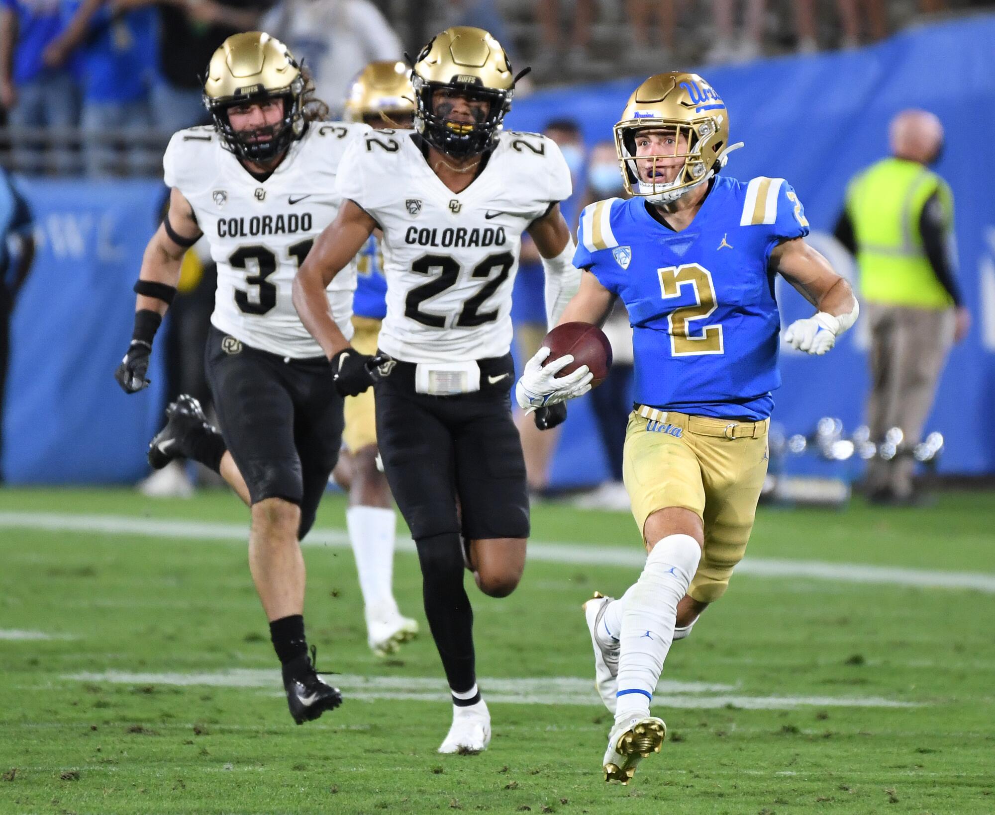 UCLA punt returner Kyle Phillips outruns Colorado's special teams unit.