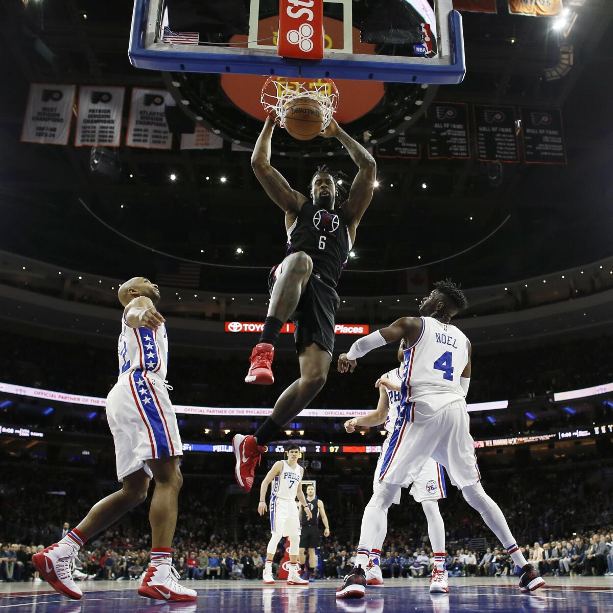 Clippers center DeAndre Jordan (6) dunks the ball as 76ers' Nerlens Noel and Gerald Henderson, left, watch during a game Jan. 24.