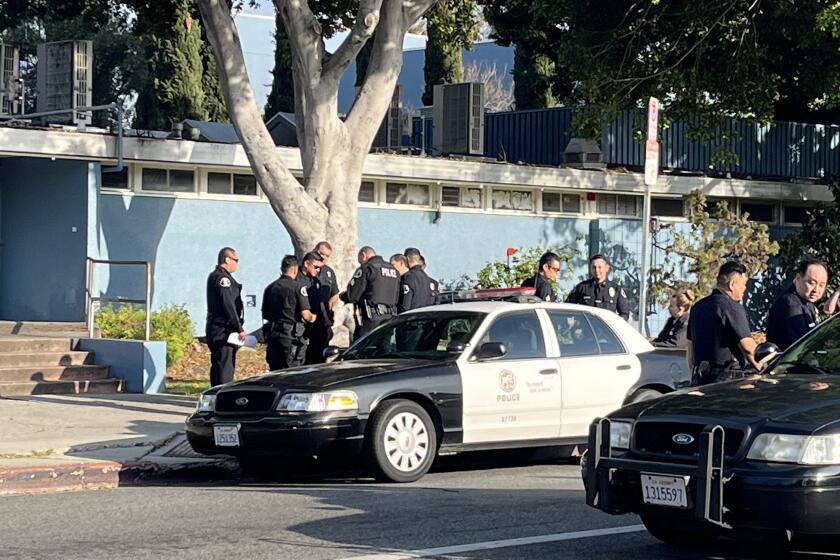 There were more than two dozen officers gathered as part of the investigation and control of the crime scene. This is along Rimpau just south of Olympic.