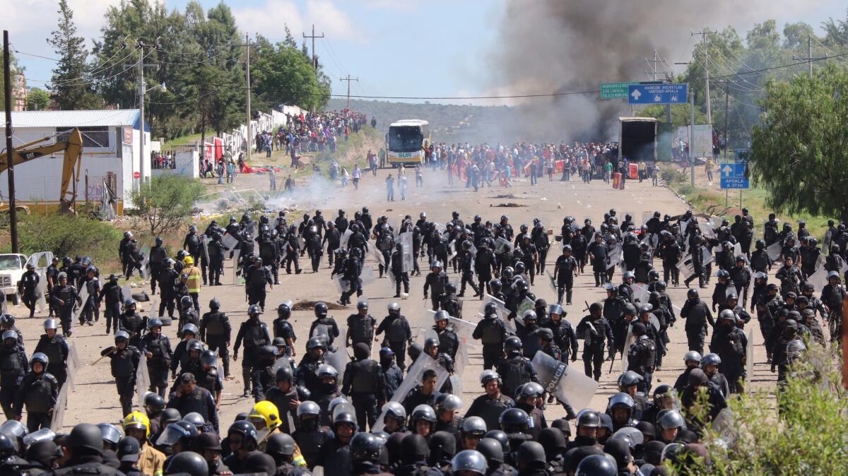 About 800 federal and state officers were sent to Nochixtlan to remove the roadblock erected by protesting teachers. (Luis Alberto Hernandez / Associated Press)