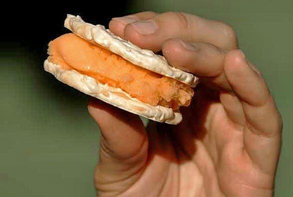 A refreshing twist on an ice cream sandwich. Recipe: Hazelnut meringues with orange sherbet
