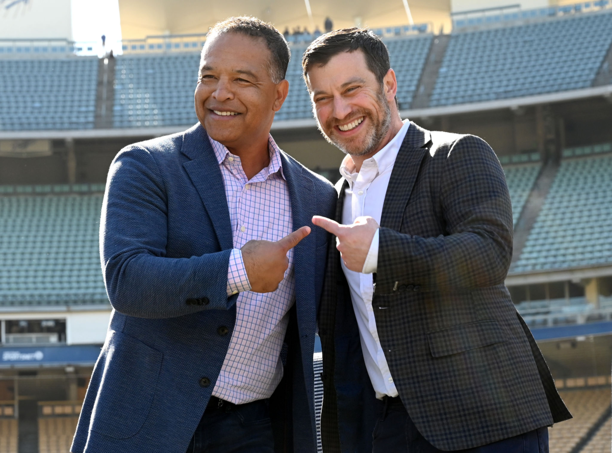 Dodgers manager Dave Roberts, left, and Dodgers president of baseball operations Andrew Friedman.