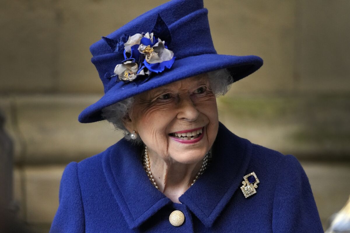 Britain's Queen Elizabeth II in a royal blue jacket and hat