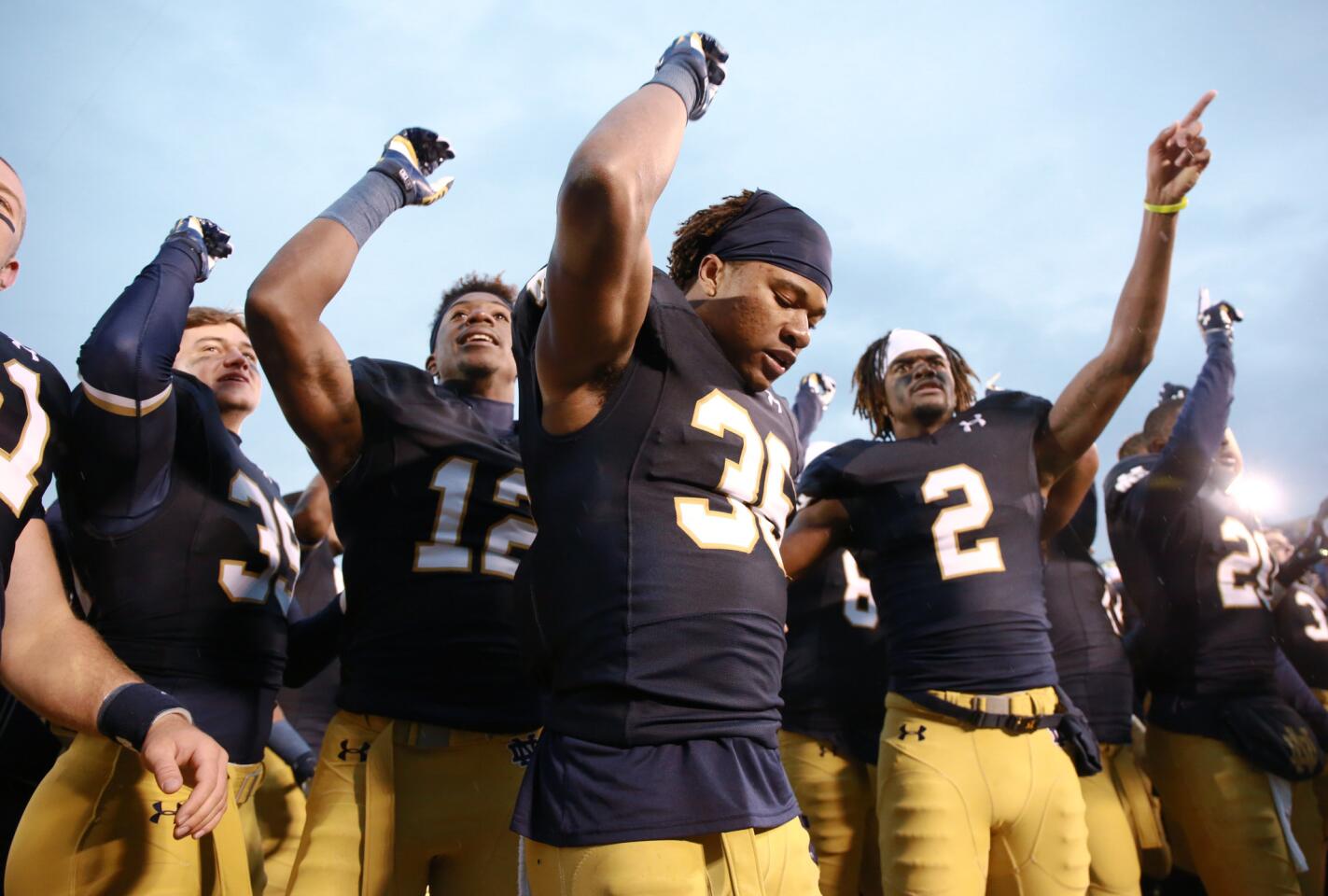 Notre Dame cornerback Cole Luke (36) celebrates with teammates after beating Stanford.