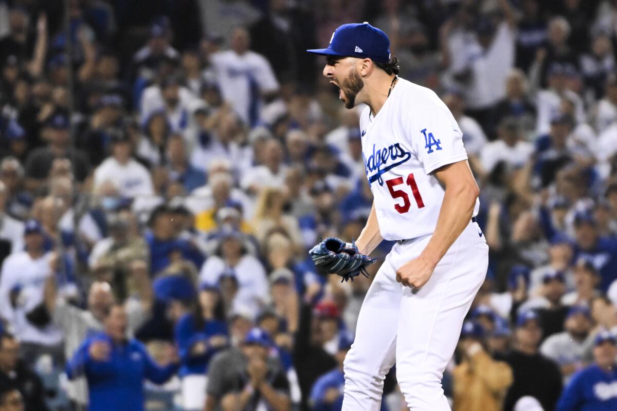 Dodgers relief pitcher Alex Vesia reacts after striking out San Diego's Austin Nola during the seventh inning.