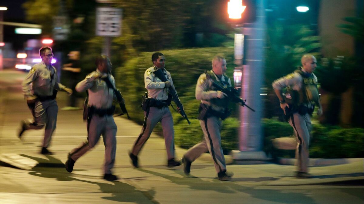 Police respond to the scene of the shooting Oct. 1, 2017, near the Mandalay Bay casino on the Las Vegas Strip.